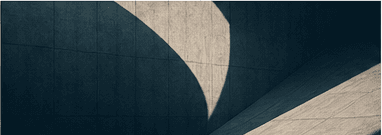 Light and shadow across a strong architectural surface
